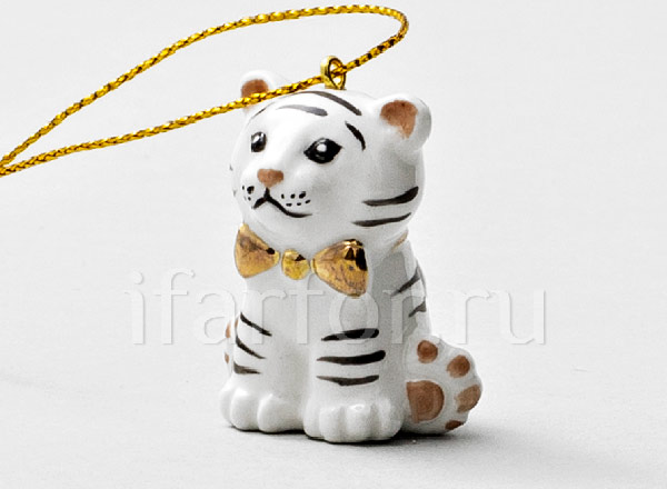 Christmas tree toy Tiger cub with a bow White
