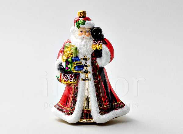 Christmas tree toy in a gift box Santa Claus with drum and toys