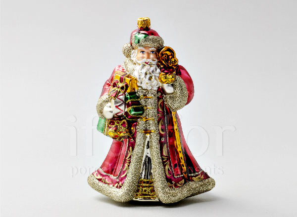 Christmas tree toy in a gift box Santa Claus with drum and toys