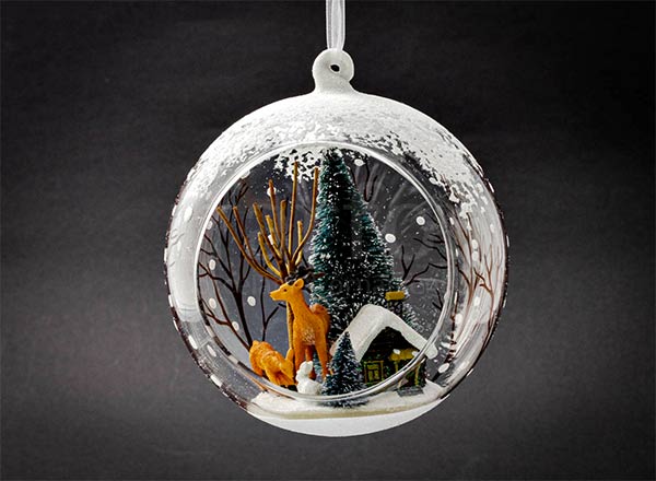 Christmas tree toy Winter forest in an open ball