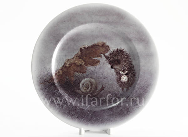 Decorative plate in a gift box Hedgehog in the fog. Hedgehog and leaf