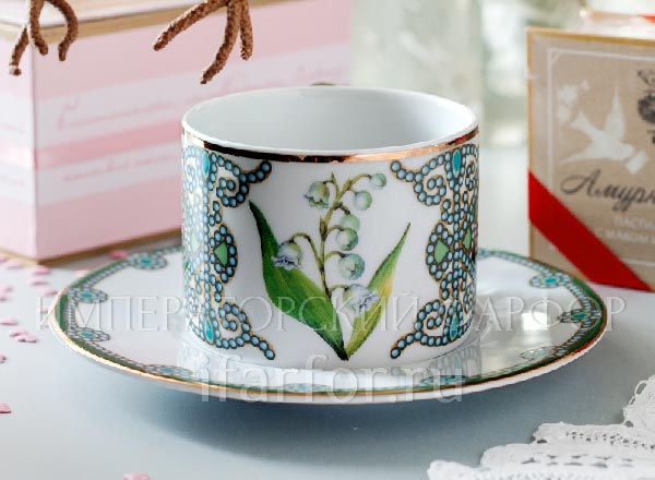 Cup and saucer tea Flowers and berries of Russia. May lily of the valley Solo